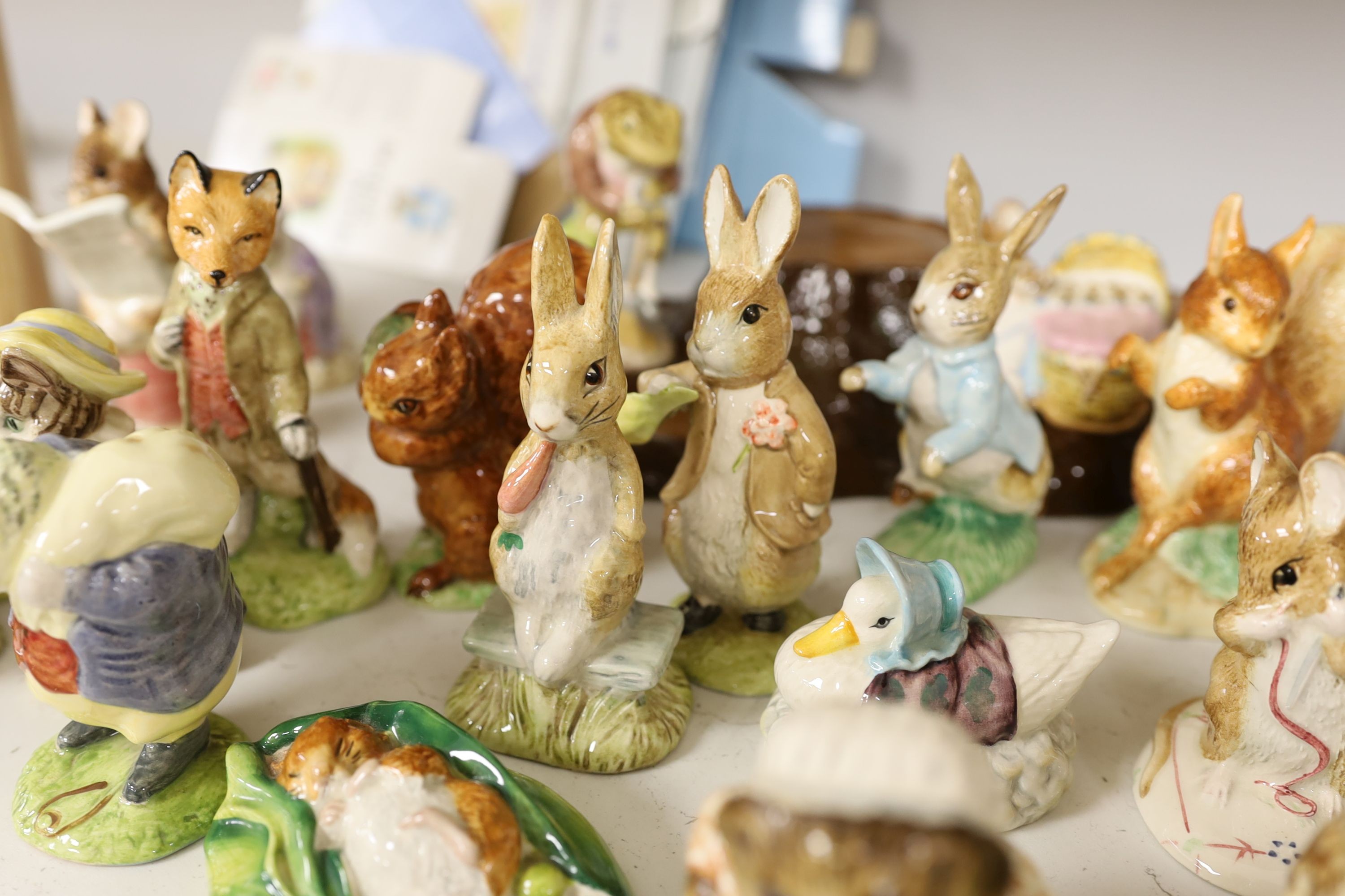 A collection Beswick, Royal Albert and Border Fine Arts Beatrix Potter figures